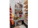 Well-organized walk-in pantry with adjustable wire shelving, providing ample storage for groceries and kitchen items at 944 Benjamin Trl, Davenport, FL 33837