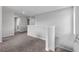 Hallway upstairs with neutral walls and carpet at 944 Benjamin Trl, Davenport, FL 33837