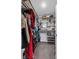 Custom closet with shelves and hanging rods for organized storage at 944 Benjamin Trl, Davenport, FL 33837