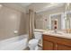 Bathroom featuring a combined shower and tub, vanity, and neutral paint at 9440 Myrtle Creek Ln # 1003, Orlando, FL 32832
