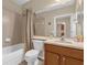 Well-lit bathroom with a shower/tub combo, neutral walls, and lots of storage at 9440 Myrtle Creek Ln # 1003, Orlando, FL 32832