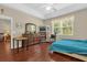 Spacious bedroom featuring wood floors, fan, and large window at 9440 Myrtle Creek Ln # 1003, Orlando, FL 32832