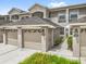 Attractive townhome with attached garages and well-maintained landscaping at 9440 Myrtle Creek Ln # 1003, Orlando, FL 32832