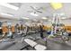Well-equipped fitness center with treadmills, weights, and plenty of open space for exercise at 9440 Myrtle Creek Ln # 1003, Orlando, FL 32832