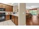 The kitchen features stainless appliances and lots of cabinet space and is adjacent to the living area at 9440 Myrtle Creek Ln # 1003, Orlando, FL 32832