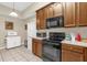 The kitchen features stainless appliances, ample counter space, and lots of cabinet space at 9440 Myrtle Creek Ln # 1003, Orlando, FL 32832