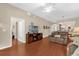 Spacious living room with hardwood floors, a TV, and lots of natural light at 9440 Myrtle Creek Ln # 1003, Orlando, FL 32832