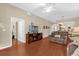 Inviting living room with wood floors, ceiling fan, and comfortable seating at 9440 Myrtle Creek Ln # 1003, Orlando, FL 32832