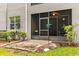 Screened-in patio with bird feeder, brick-paved flooring, and ceiling fan at 9440 Myrtle Creek Ln # 1003, Orlando, FL 32832