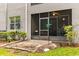 Cozy screened-in patio with a bird feeder and outdoor seating area at 9440 Myrtle Creek Ln # 1003, Orlando, FL 32832