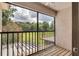 Screened balcony with views of a lush green space at 995 Troon Trce, Winter Springs, FL 32708