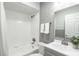 Bright bathroom featuring a shower over bath, modern fixtures and a vanity with a sink at 995 Troon Trce, Winter Springs, FL 32708
