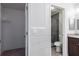 Bathroom with tiled shower, vanity and adjacent walk-in closet at 995 Troon Trce, Winter Springs, FL 32708