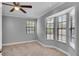 Bedroom with neutral carpet, ceiling fan, and large windows at 995 Troon Trce, Winter Springs, FL 32708