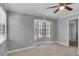 Bedroom with neutral carpet, ceiling fan, and bay window at 995 Troon Trce, Winter Springs, FL 32708