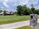 A golf course view from the property is surrounded by lush green grass and mature trees at 995 Troon Trce, Winter Springs, FL 32708