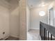Well-lit hallway with a staircase, carpet, railing, closet and a round window at 995 Troon Trce, Winter Springs, FL 32708