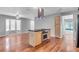 Updated kitchen with wood cabinets, stainless appliances, and center island cooktop at 995 Troon Trce, Winter Springs, FL 32708