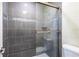 Bathroom featuring tiled shower with glass door at 995 Troon Trce, Winter Springs, FL 32708