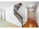 Bright staircase with wood and wrought iron banister in a modern home at 995 Troon Trce, Winter Springs, FL 32708