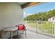 Cozy balcony with outdoor seating overlooking a lush, wooded backyard at 10009 Randal Walk St, Orlando, FL 32832