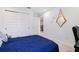 Bedroom featuring a closet with sliding doors and an open door to the hallway at 10009 Randal Walk St, Orlando, FL 32832