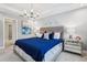 Luxurious primary bedroom features a tray ceiling and ample natural light at 10009 Randal Walk St, Orlando, FL 32832