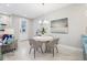 Bright dining area featuring a modern round table, stylish chairs, and contemporary decor at 10009 Randal Walk St, Orlando, FL 32832