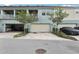 Townhome garages with driveways, offering convenient parking and storage at 10009 Randal Walk St, Orlando, FL 32832