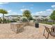 Outdoor grill area featuring stone countertops, seating, and community landscaping at 10009 Randal Walk St, Orlando, FL 32832