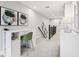 Bright hallway area with a built-in desk and staircase view at 10009 Randal Walk St, Orlando, FL 32832