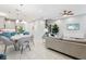 Open-concept living space with modern furniture, sleek decor, and seamless flow to the kitchen at 10009 Randal Walk St, Orlando, FL 32832