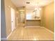 Open-concept living room with tile flooring, seamlessly connecting to the kitchen at 10604 Savannah Wood Dr # 84, Orlando, FL 32832