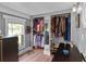 Spacious closet featuring built-in storage and a window, filled with clothes and accessories at 110 N Brown Ave, Orlando, FL 32801