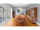 Elegant dining room with a large table, hardwood floors, and sliding glass doors to patio at 110 N Brown Ave, Orlando, FL 32801