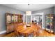 Spacious dining room featuring hardwood floors, a china cabinet, and an open floor plan at 110 N Brown Ave, Orlando, FL 32801