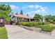 Charming home with lush landscaping, a well-maintained lawn, and a welcoming driveway at 110 N Brown Ave, Orlando, FL 32801
