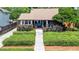 Charming home with beautiful landscaping, a cozy front porch, and a welcoming entrance at 110 N Brown Ave, Orlando, FL 32801