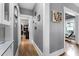 Hallway with wood floors, gray walls with white trim, and views to other rooms at 110 N Brown Ave, Orlando, FL 32801