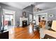 Bright living room with a charming fireplace, hardwood floors, and an open layout at 110 N Brown Ave, Orlando, FL 32801