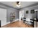 An office featuring hardwood floors, gray walls, and a ceiling fan at 110 N Brown Ave, Orlando, FL 32801