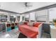 Bright sunroom with ample windows, daybed, and stylish decor at 110 N Brown Ave, Orlando, FL 32801