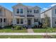 Charming two-story home with stone accents, manicured lawn, and inviting front entrance at 11188 Hollow Bay Dr, Winter Garden, FL 34787