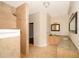 Bright bathroom featuring a walk-in tiled shower, and a vanity with granite counters and double sinks at 13524 Lake Luntz Dr, Winter Garden, FL 34787