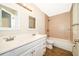 Bathroom featuring double sink vanity with a tub and shower combo at 13524 Lake Luntz Dr, Winter Garden, FL 34787