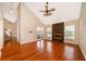 Spacious living room featuring a fireplace, ceiling fan, and french doors leading to the backyard at 13524 Lake Luntz Dr, Winter Garden, FL 34787