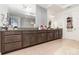 Large bathroom vanity with granite counters and dual sinks, plus tile floors at 13556 Abberwick Dr, Orlando, FL 32832