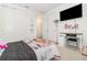 Bedroom featuring a desk, closet, and modern decor at 13556 Abberwick Dr, Orlando, FL 32832