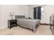 Neutral bedroom featuring carpet flooring, a queen bed, window with curtain, and a nightstand at 13556 Abberwick Dr, Orlando, FL 32832