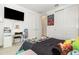 Bedroom featuring a large television and closet space at 13556 Abberwick Dr, Orlando, FL 32832